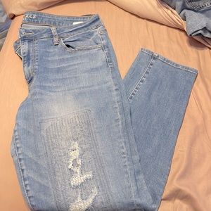 Stylish holy jeans from American Eagle. Size 18. Light wash.